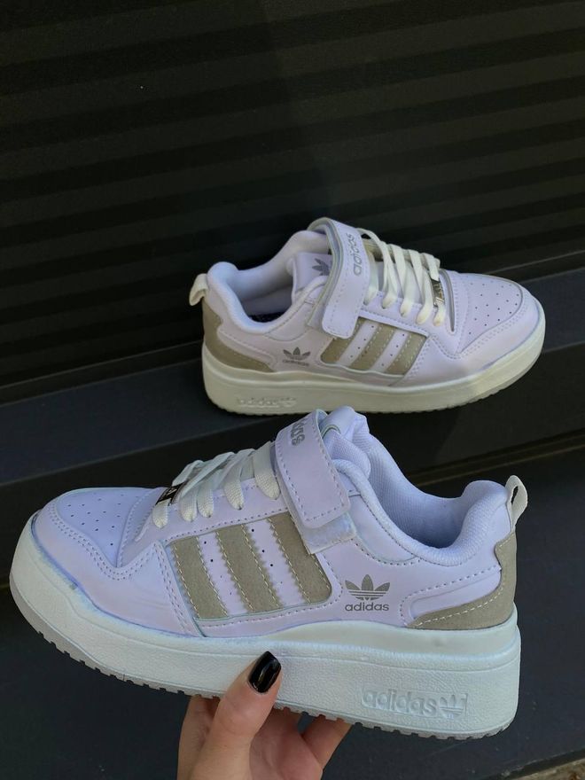 beige and white adidas