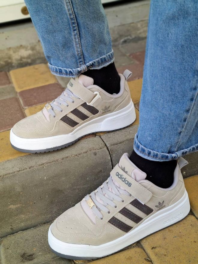 beige and white adidas