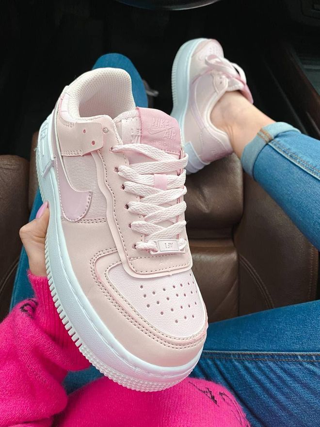 pink and white nike high tops